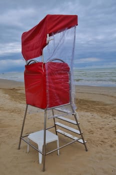 Lifeguard watch tower on the beach on the seaside