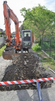 Road works construction site excavation with caterpillar