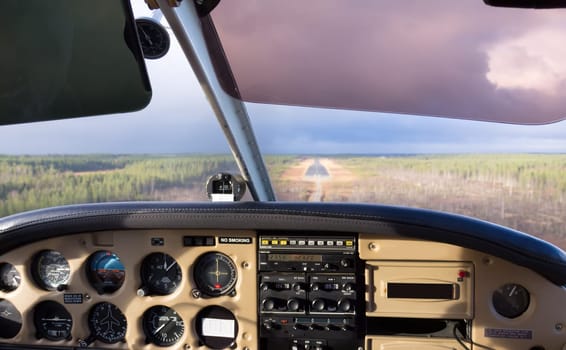 Cockpit view from small aircraft taking off from runway
