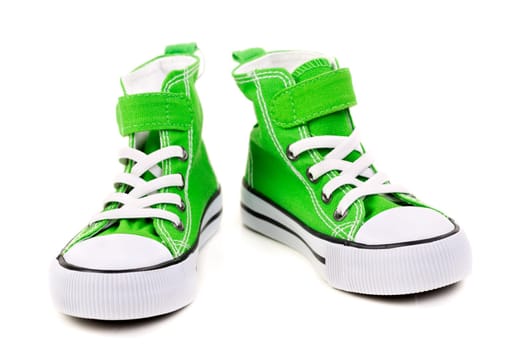 green sneakers with white laces isolated on white