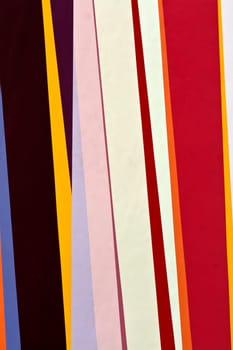 background of colored bands painted on the wall paint carnival