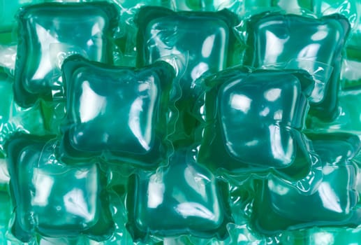 Green gel laundry capsules, background