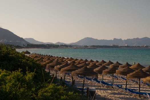 Beach area with umbrellas in Alcudia in Mallorca