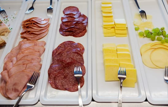 sliced ​​cheese and sausage at the restaurant
