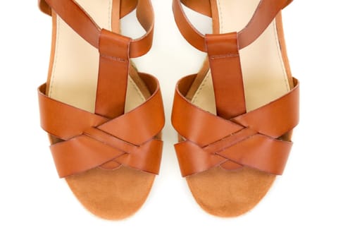 Pair of brown female shoes isolated on white background