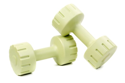 Two green glossy dumbbell isolated on white