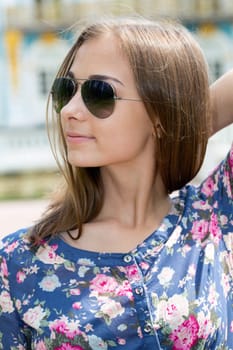 Summer portrait of a beautiful young Caucasian girl