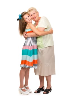 Grandmother with her granddaughter in the studio on a white isolate.