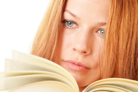Young woman reading a book. Female student learning