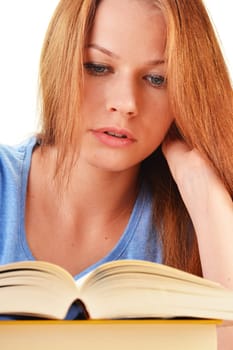 Young woman reading a book. Female student learning