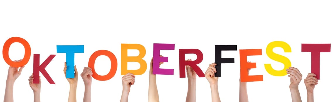Many Hands Holding the German Word Oktoberfest Which is the Name of a Huge Festival