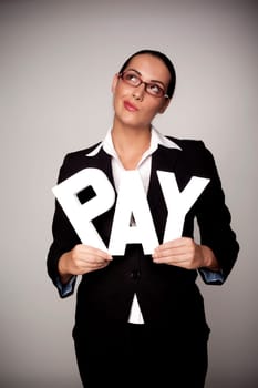 A income concept image of a woman holding letters that spell out the word pay demonstrating fare pay for woman.