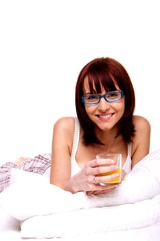 A young woman on her bed relaxing in the morning.