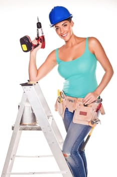 A woman wearing a DIY tool belt full of a variety of useful tools on a white background.