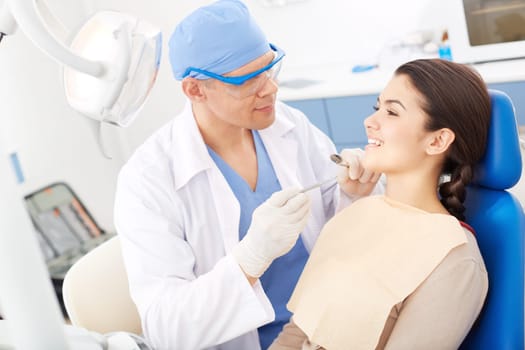 Young girl during oral checkup at the dentist’s