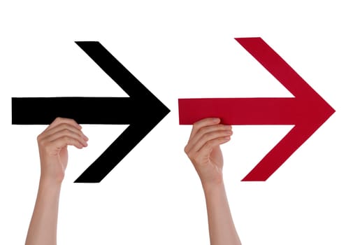Two hands Hold a Red and a Black Arrow