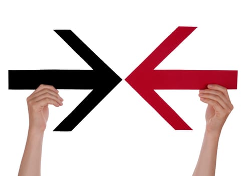 Two Hands Hold Two Arrows Which Point to Each Other, Isolated