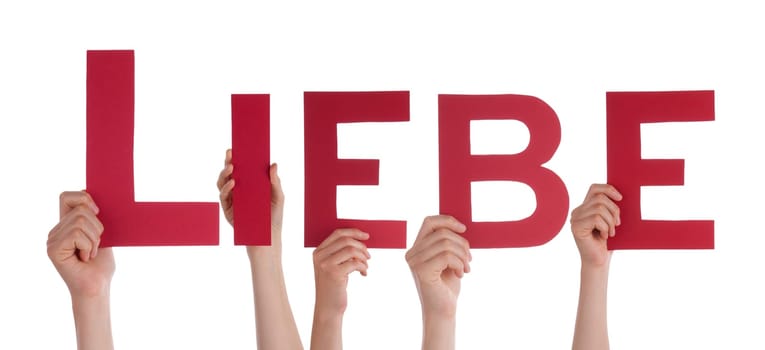 Some Hands Holding the Red German Letters Liebe, Which Means Love, Isolated