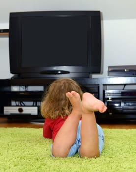 child is watching TV