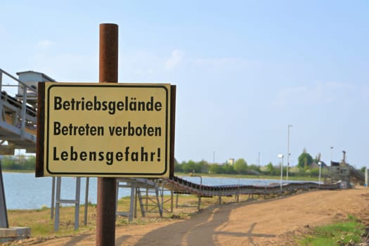 Prohibition sign at a quarry lake