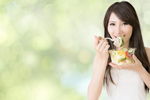 Asian beauty eat salad, closeup portrait.