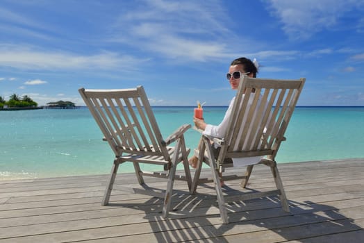 happy young couple relax and take fresh drink at summer vacation
