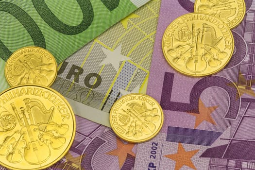 Gold coins from Austria Motif Vienna Philharmonic on euro banknotes