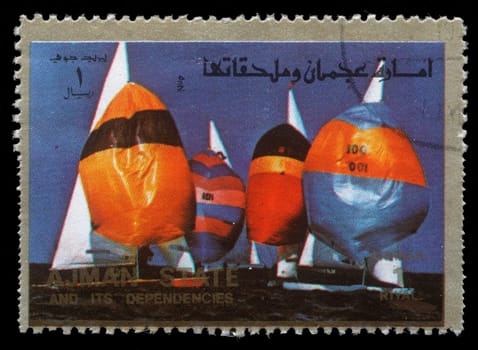 AJMAN - CIRCA 1973: a stamp printed in the Ajman shows Sailing, Summer Olympics, circa 1973