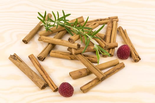 Cinnamon sticks on wooden board