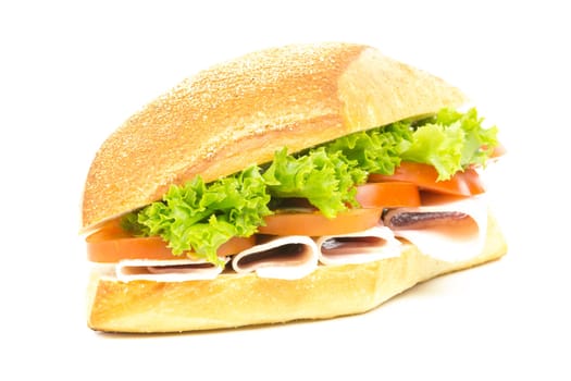 Sandwich with ham tomatoes and salad
