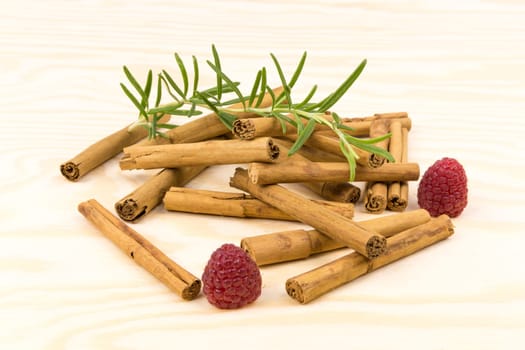 Cinnamon sticks on wooden board