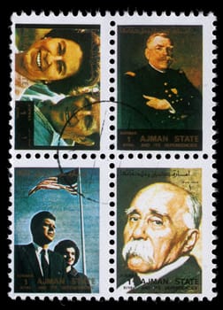 AJMAN - CIRCA 1973: stamp printed by Ajman shows Queen Elizabeth and Prince Philip Mountbatten, American officer, President Kennedy and Jacqueline Kennedy, Georges Clemenceau, circa 1973