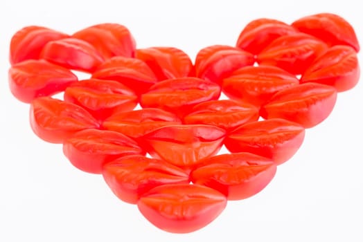 Red and cream gummy bones over white