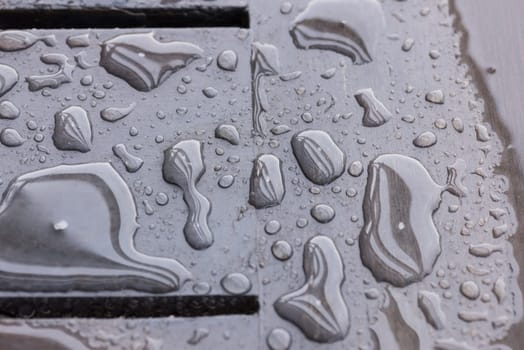 Raindrops on wooden deck