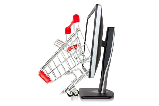 Shopping cart comes out of a monitor. Isolated on white background