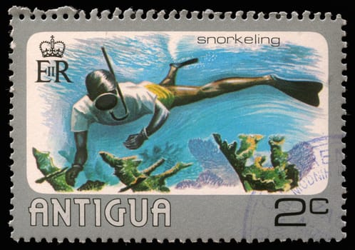 ANTIGUA - CIRCA 1976: A stamp printed in Antigua shows water snorkeling, circa 1976