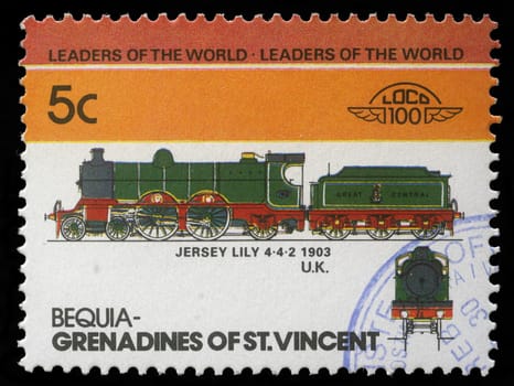 BEQUIA - CIRCA 1985: A stamp printed in Grenadines of St. Vincent shows Jersey Lily Train 4-4-2, 1903 U.K., circa 1985