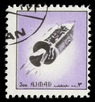 AJMAN - CIRCA 1972: A stamp printed in emirate Ajman show spaceship, circa 1972
