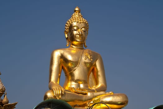 Big Buddha statue under the blue sky.