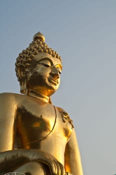 Big Buddha statue under the blue sky.