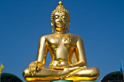 Big Buddha statue under the blue sky.