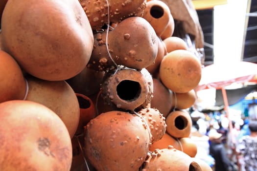 Hollowed out gourds hang for sale in an African market