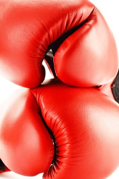 Pair of red leather boxing gloves isolated on white