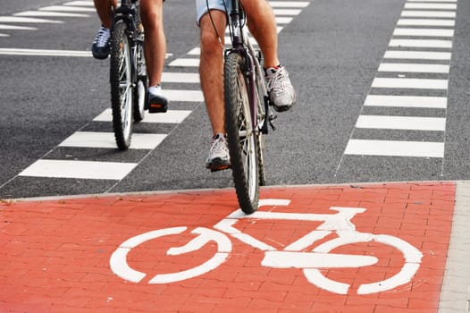 Bicycle road sign and bike riders