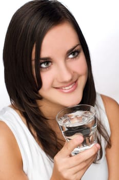 young brunette woman drinking water close up