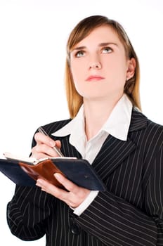young brunette business woman making notes on white