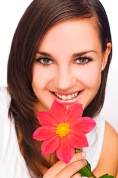young beautiful brunette with flower close up shoot