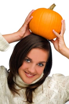 young woman holding orange pumpkin close up