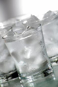 glass of fresh water with ice close up
