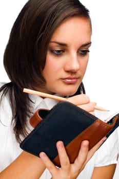 young brunette woman making notes close up